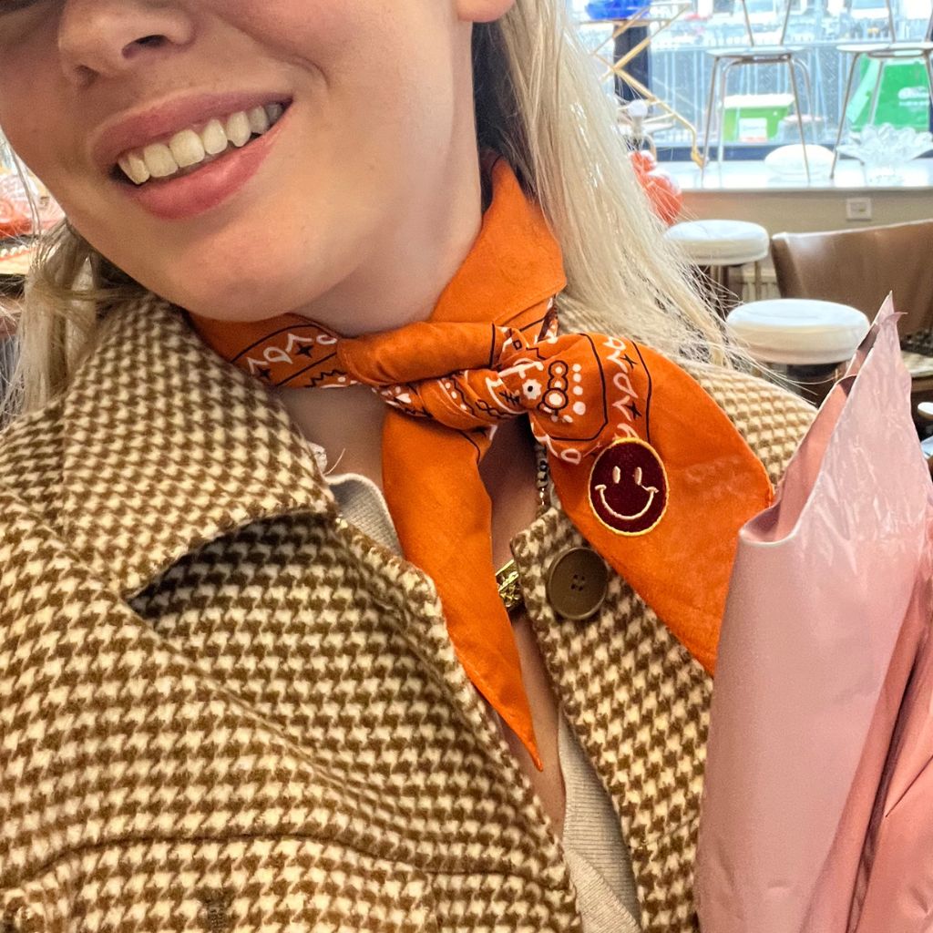 Knotted orange bandana with smiley