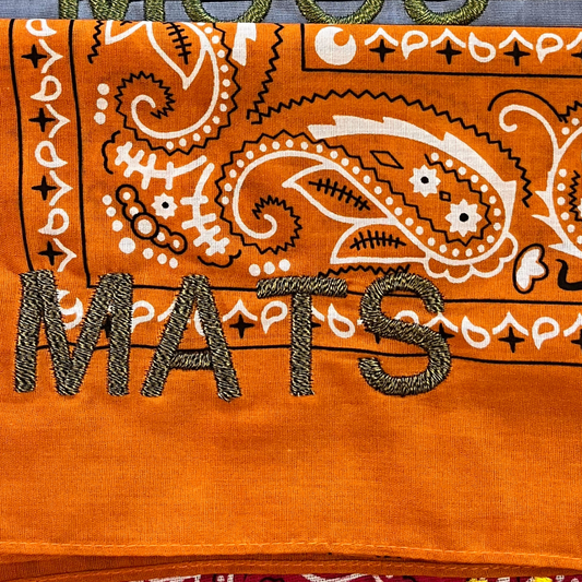Let's personalize! Orange bandana with dark green letter