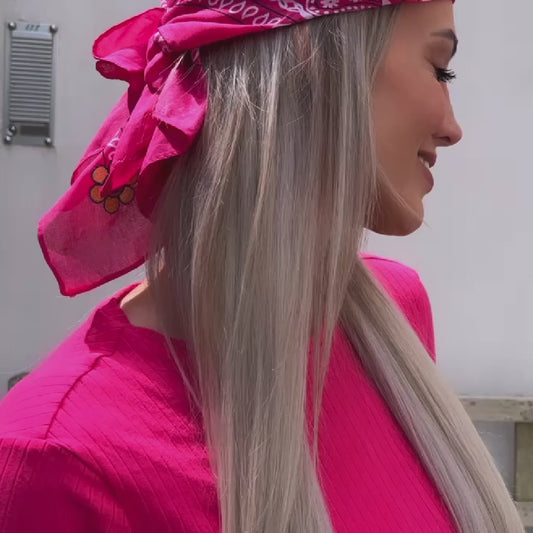 Pink knotted bandana with smiley flower