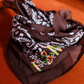 Let's personalize! Brown bandana with ombre green, orange, lilac yarn